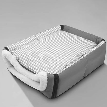 Cat resting inside soft house bed – front view