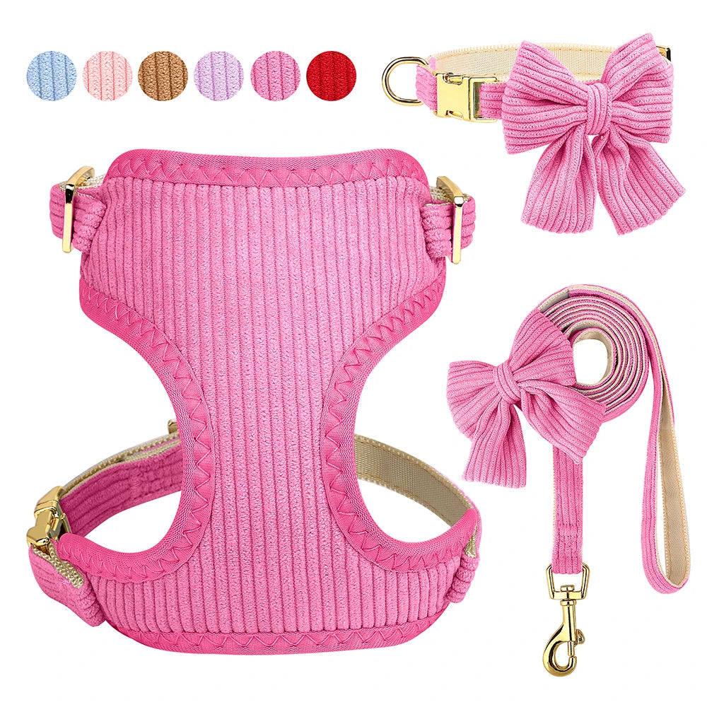 Pink dog harness, collar, and leash set with bowknot design