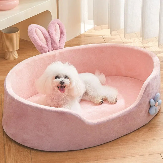 Pink round plush pet bed with rabbit ears for small dogs and cats