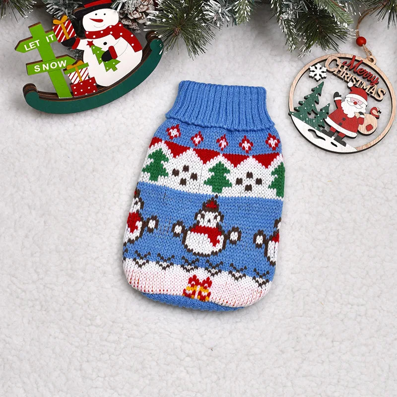 Festive pet sweater collection – flat lay