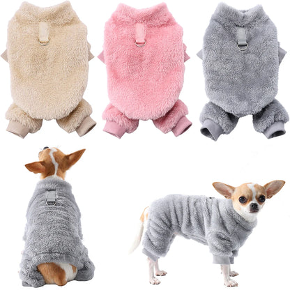 Small dog wearing pink fleece winter jumpsuit
