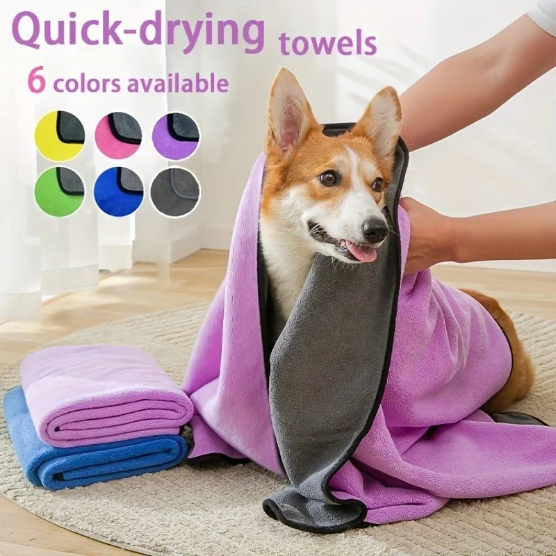 Dog wrapped in soft absorbent pet towel after bath