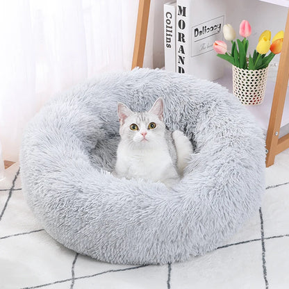 Dog resting on round plush bed – lifestyle photo