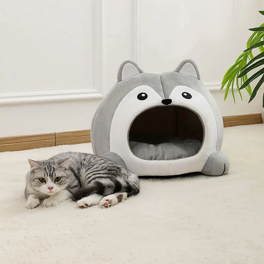 Cat sleeping inside plush enclosed pet house – lifestyle photo