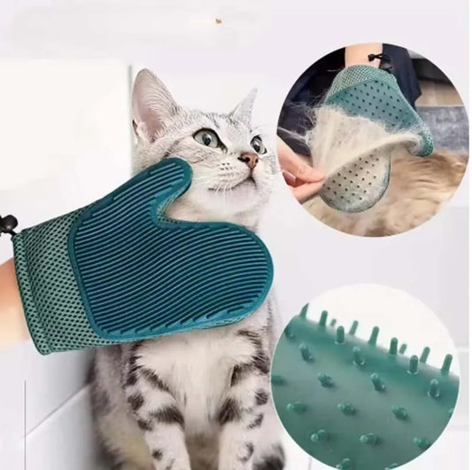 Cat being brushed with silicone pet hair removal glove