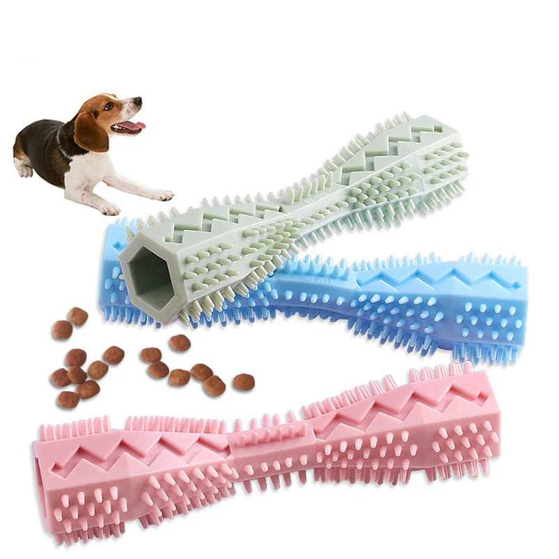 Puppy chewing pink molar toy with treat dispenser