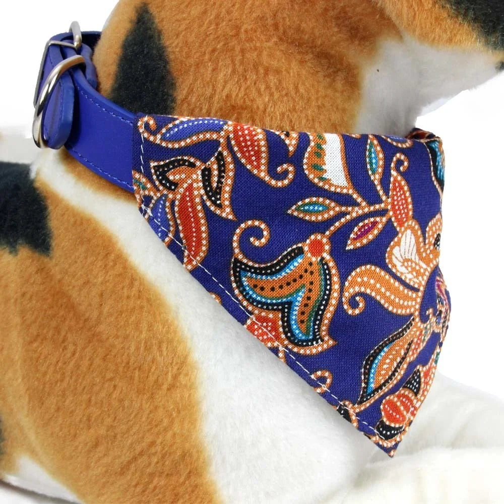 Small dog wearing stylish bandana collar
