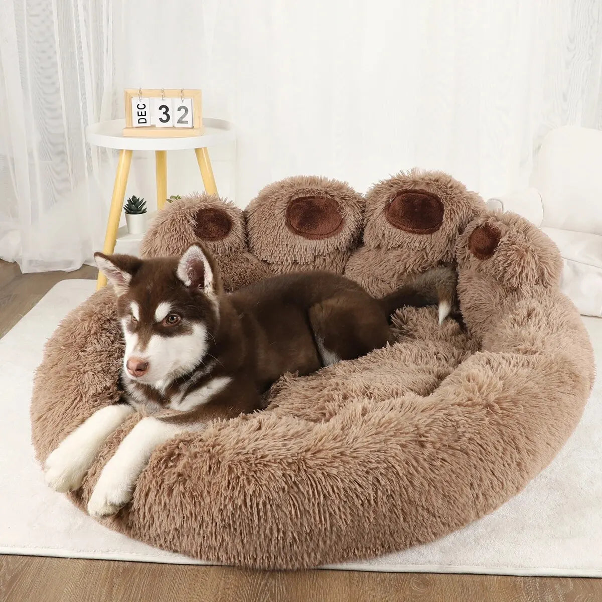 Fluffy paw-shaped dog bed in grey color
