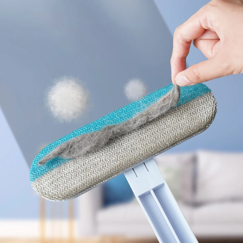 Close-up of pet hair remover tool removing fur from carpet