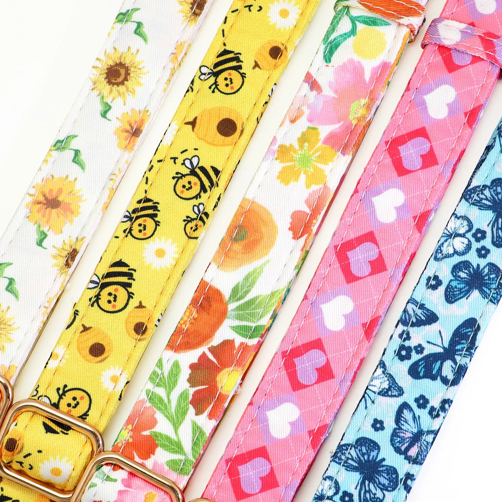 Colorful printed dog collars – floral, bee, heart and butterfly designs.