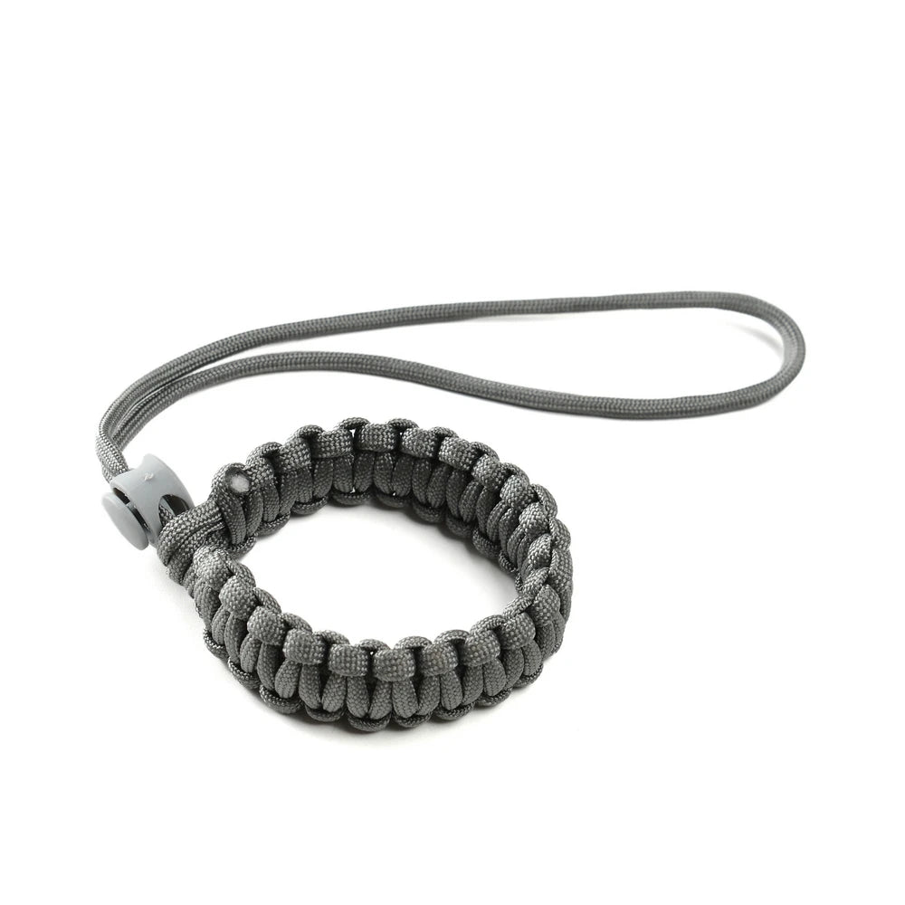 Dog owner using wrist strap with retractable leash
