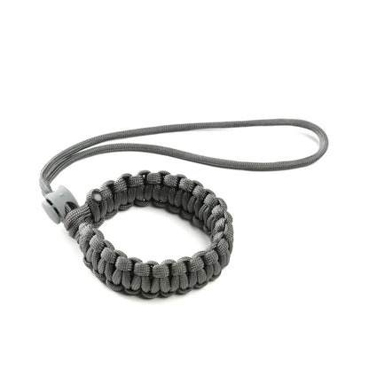 Dog owner using wrist strap with retractable leash
