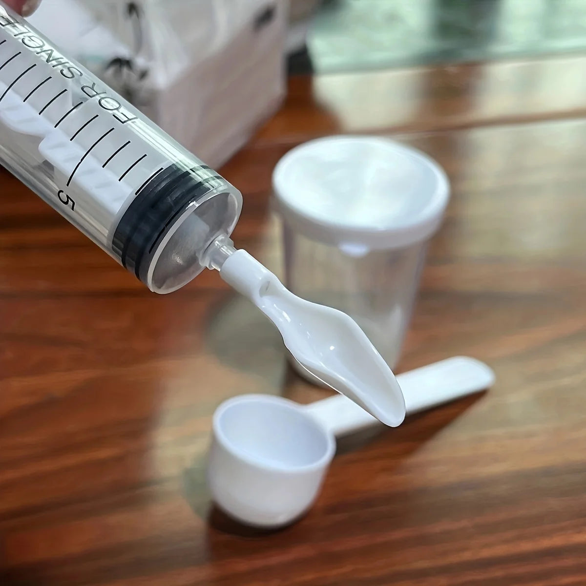 Close-up of bird feeding syringe for chicks and parrots