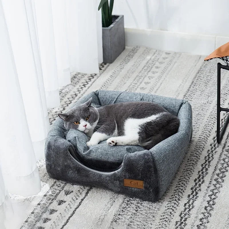 Grey triangular cat bed with removable cushion