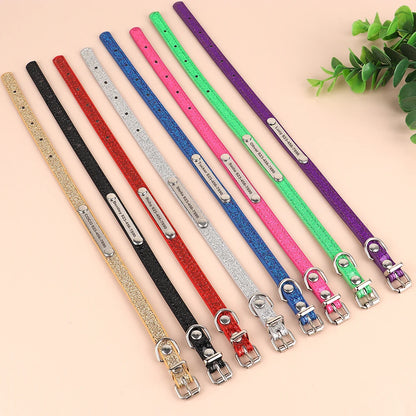 Stack of multiple collars (various colors) → "Custom bling dog and cat collars in assorted colors with engraved nameplates"