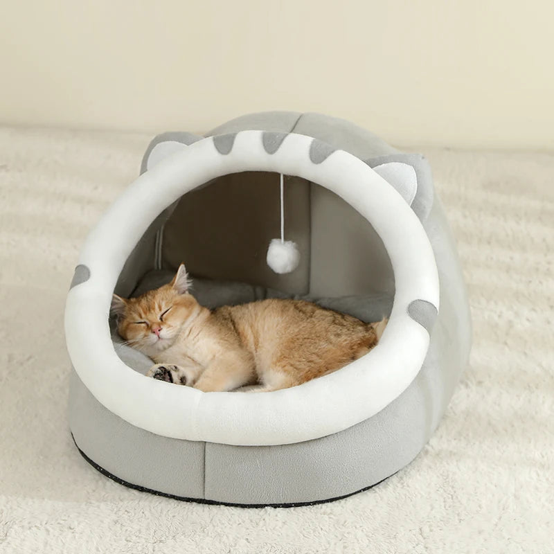 Cat resting inside warm cotton cave pet bed