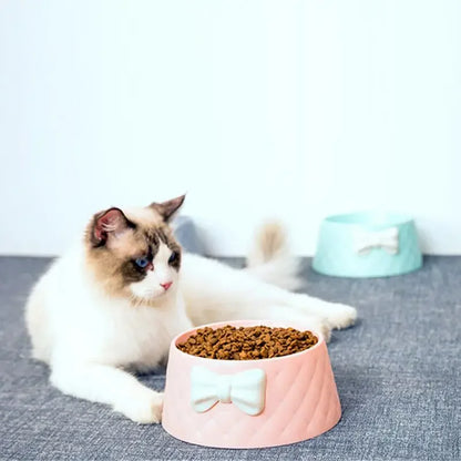 Green non-slip pet feeder bowl with decorative bow